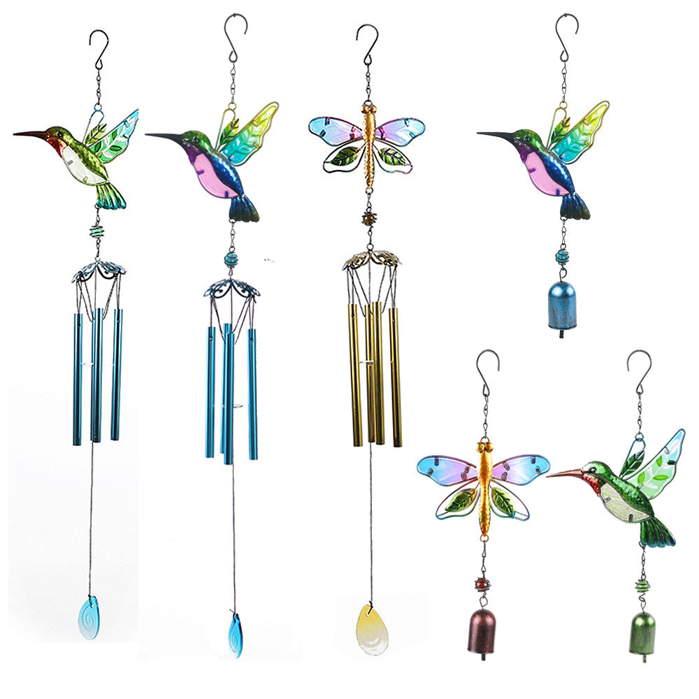 Decorative wind chime hanging in garden setting